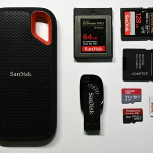 a cell phone is next to a memory card
